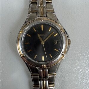 Seiko Black Dial Watch with Gold and Silver Accents